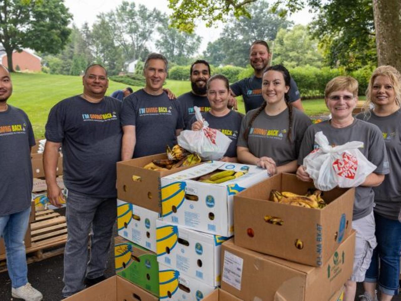 Volunteers distributing boxes of food