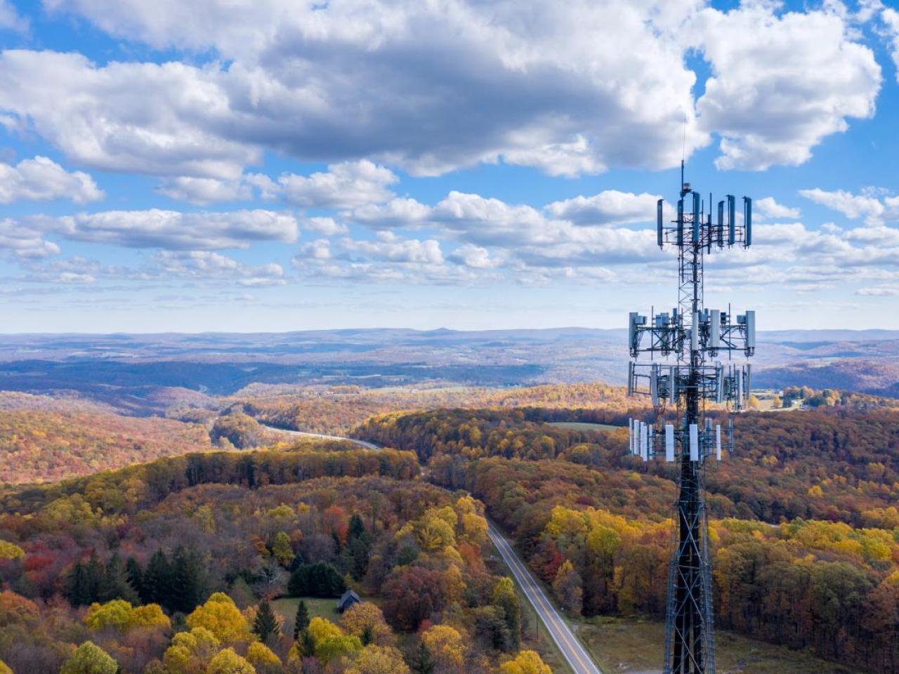 Tower shown in a beautiful field.