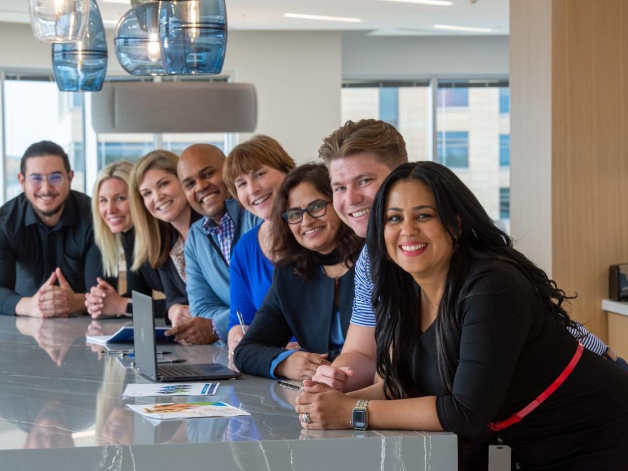 Pentair employees gather at table