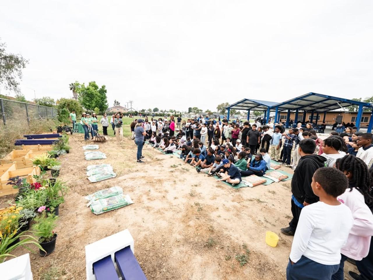 Students joined alongside volunteers to help transform the school's garden into a vibrant learning environment.
