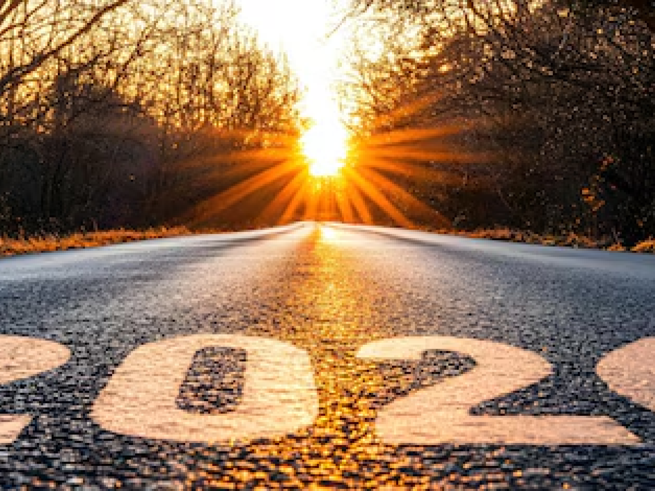 Road with setting sun and 2026
