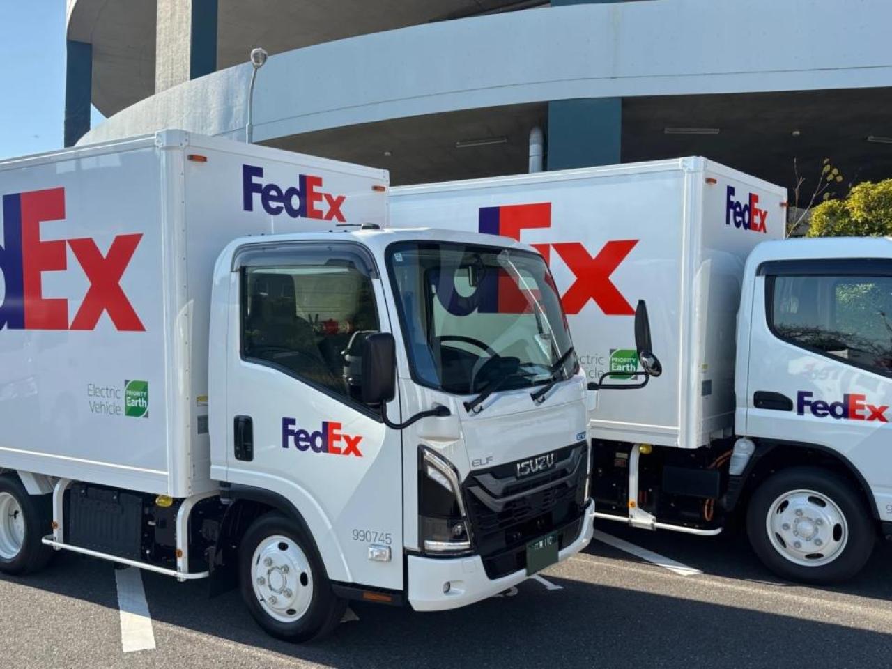 Two FedEx trucks