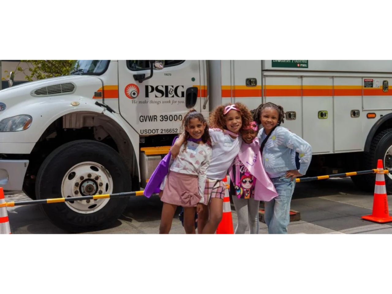 kids in front of a work truck