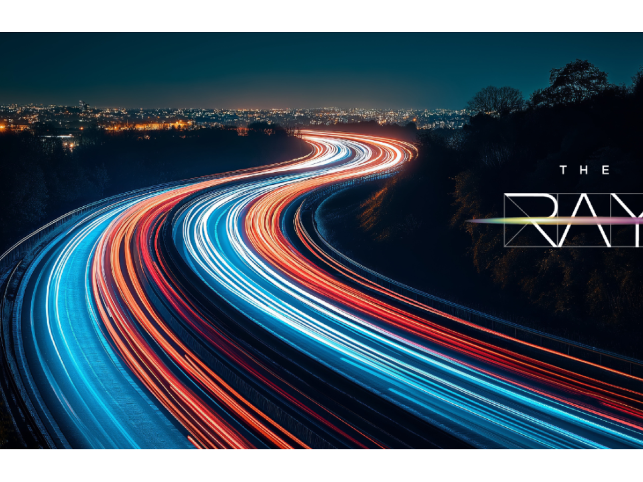 Photo of lights on highway at night with The Ray logo