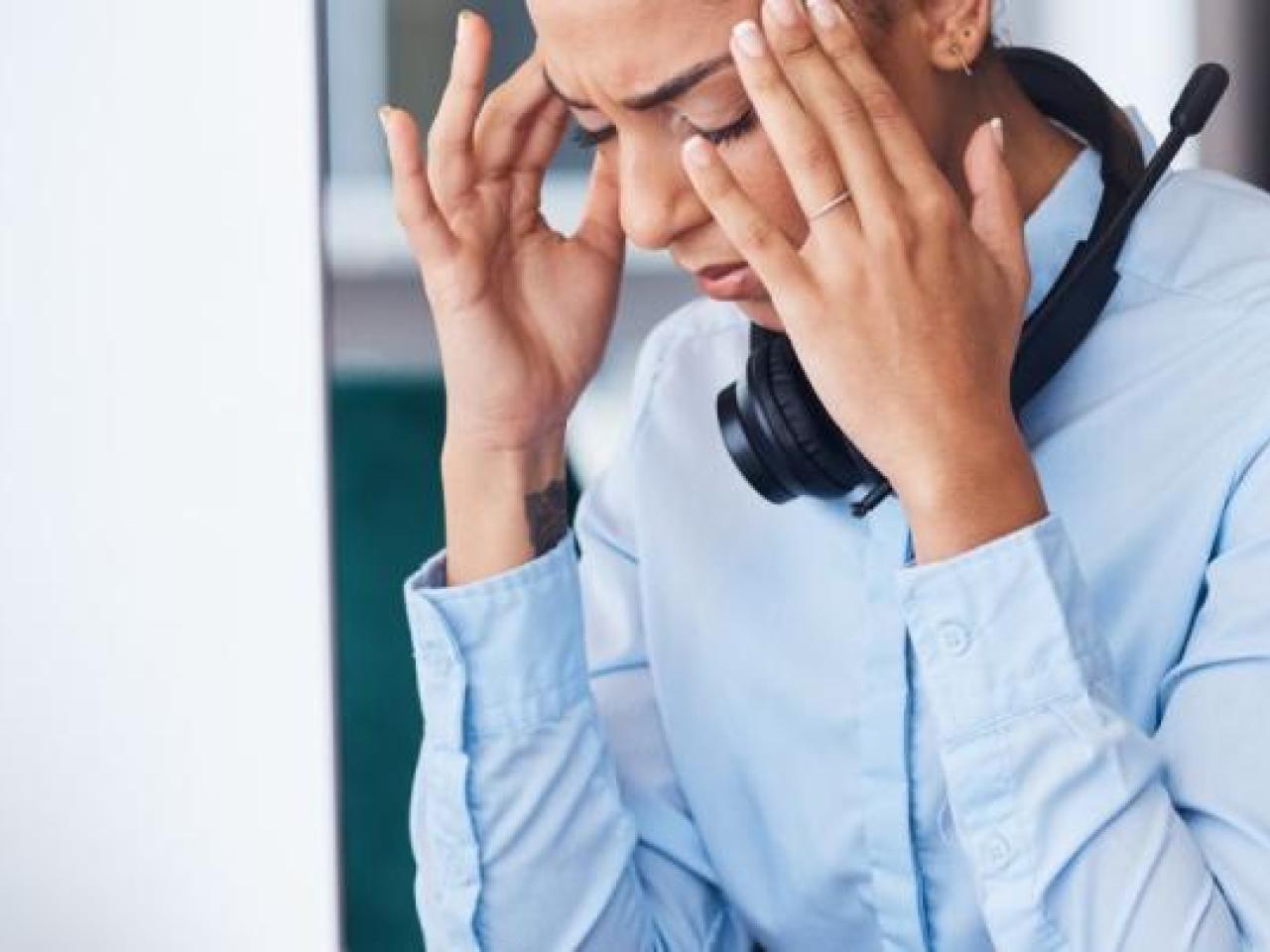 Stressed office worker in front of computer
