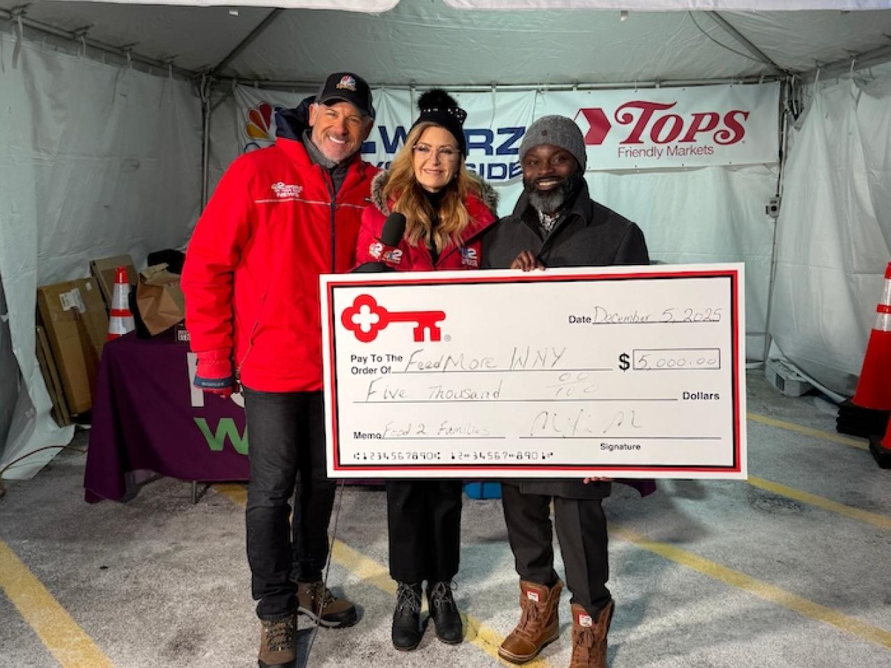 KeyBank and WGRZ Food 2 Families representatives shown with a $5,000 grant check..