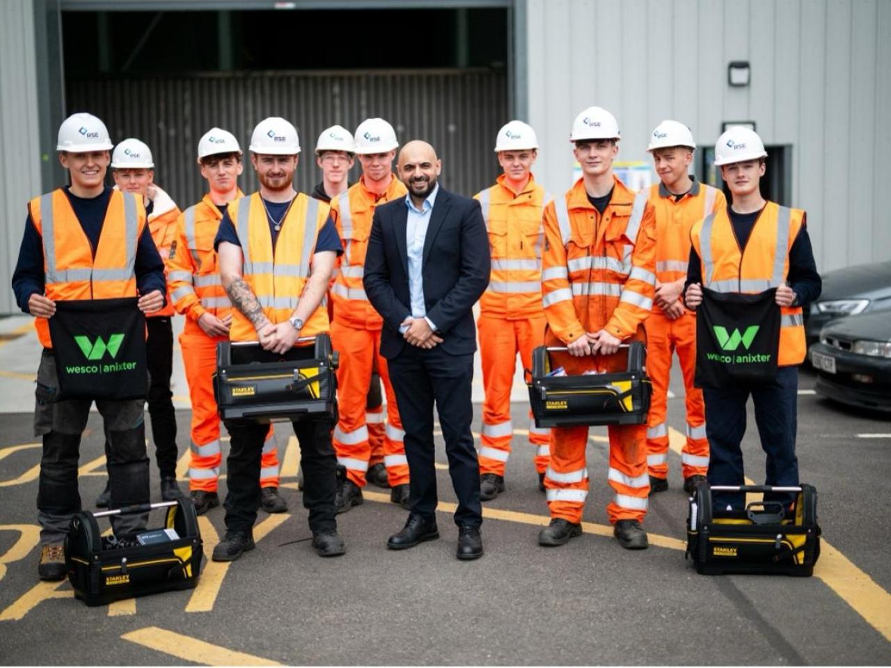 Picture: Zubi Hussain, Wesco Business Development Manager EES UK and new RSE apprentice cohort with their toolkits 