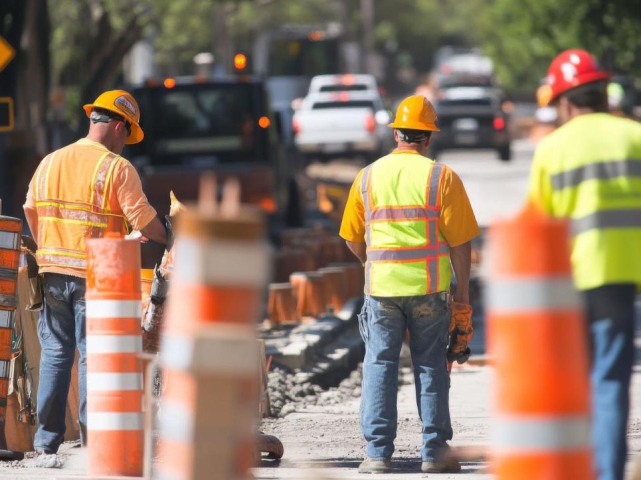 Photo of transportation workers on roadside