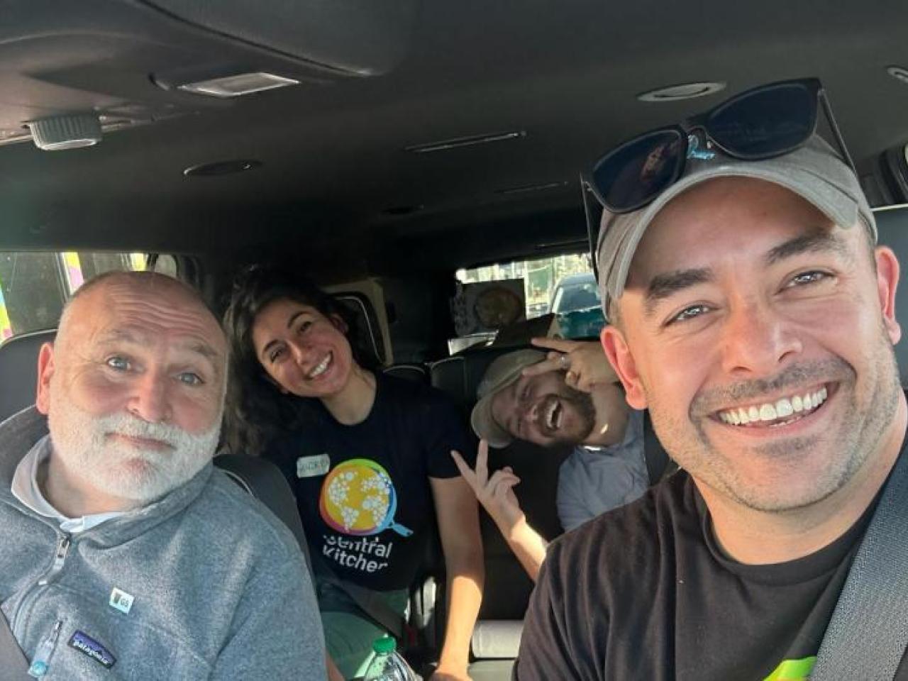 Mike Bean in a van with other volunteers