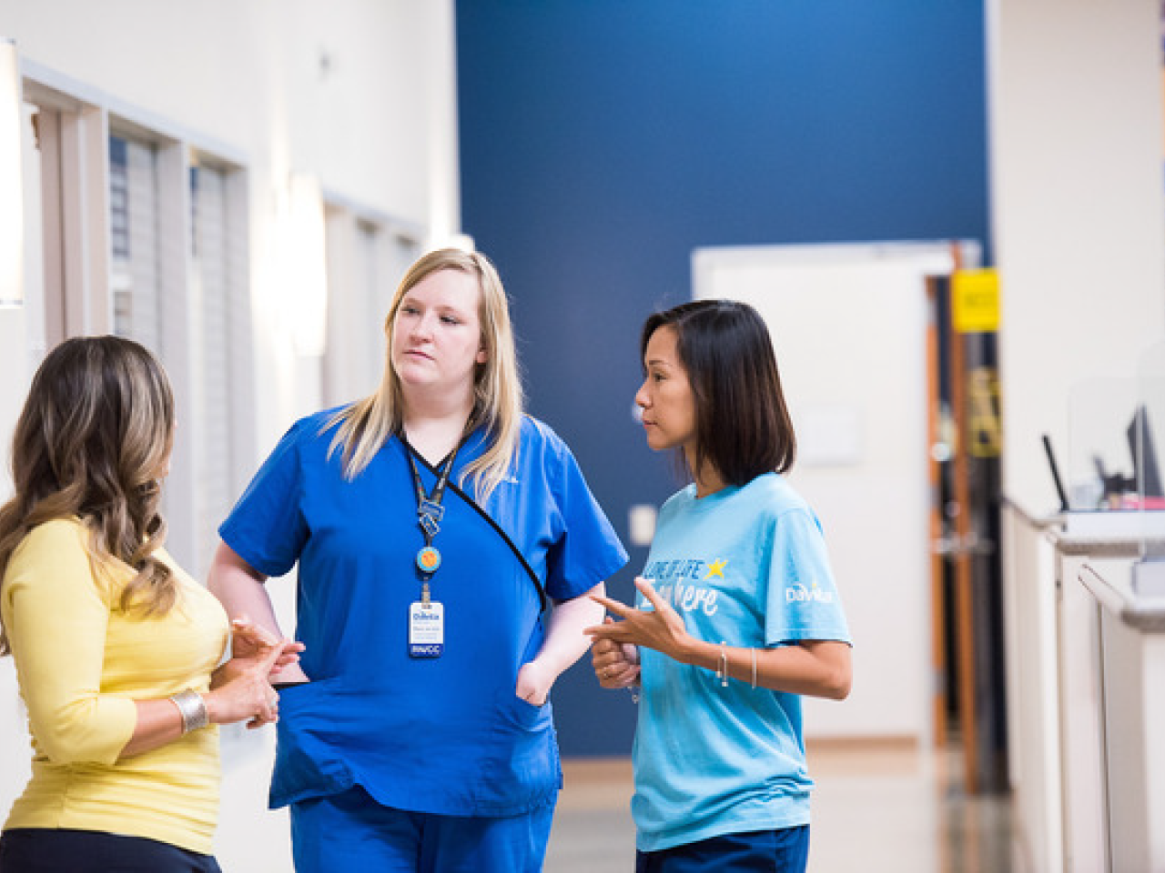 A healthcare worker talking with patients