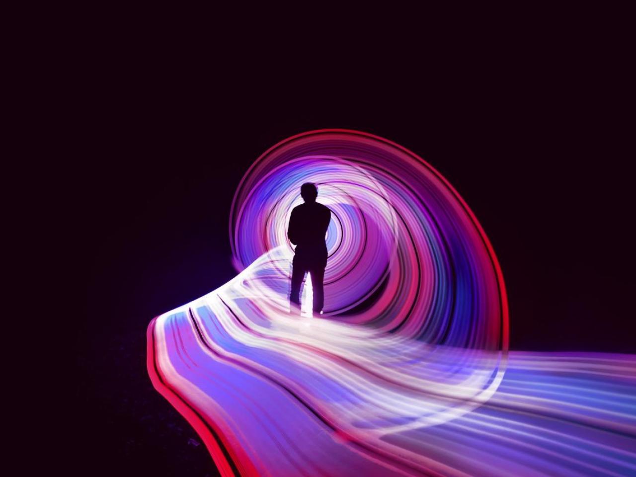 person looking at luminous light
