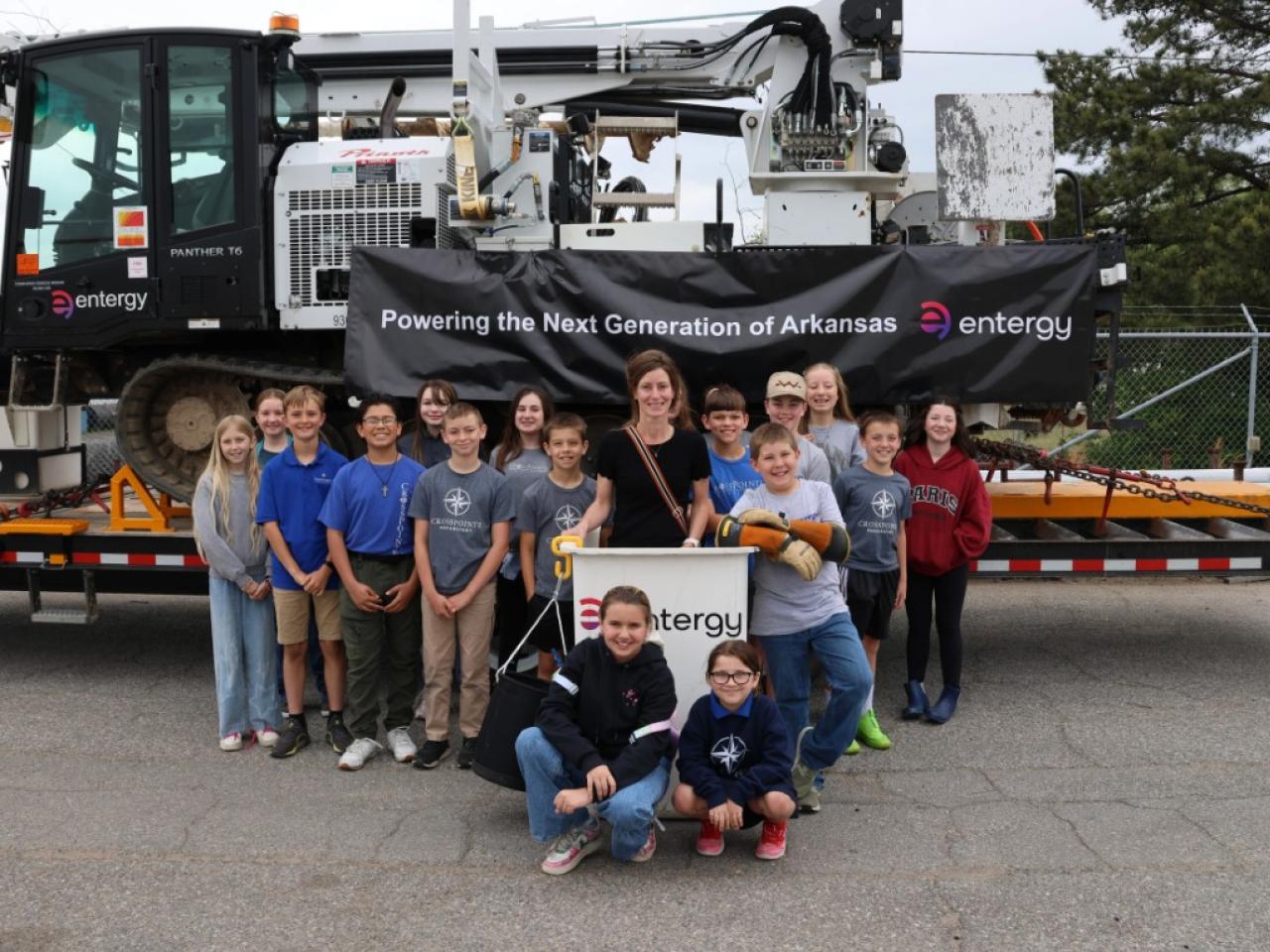 Group of students with Entergy signs
