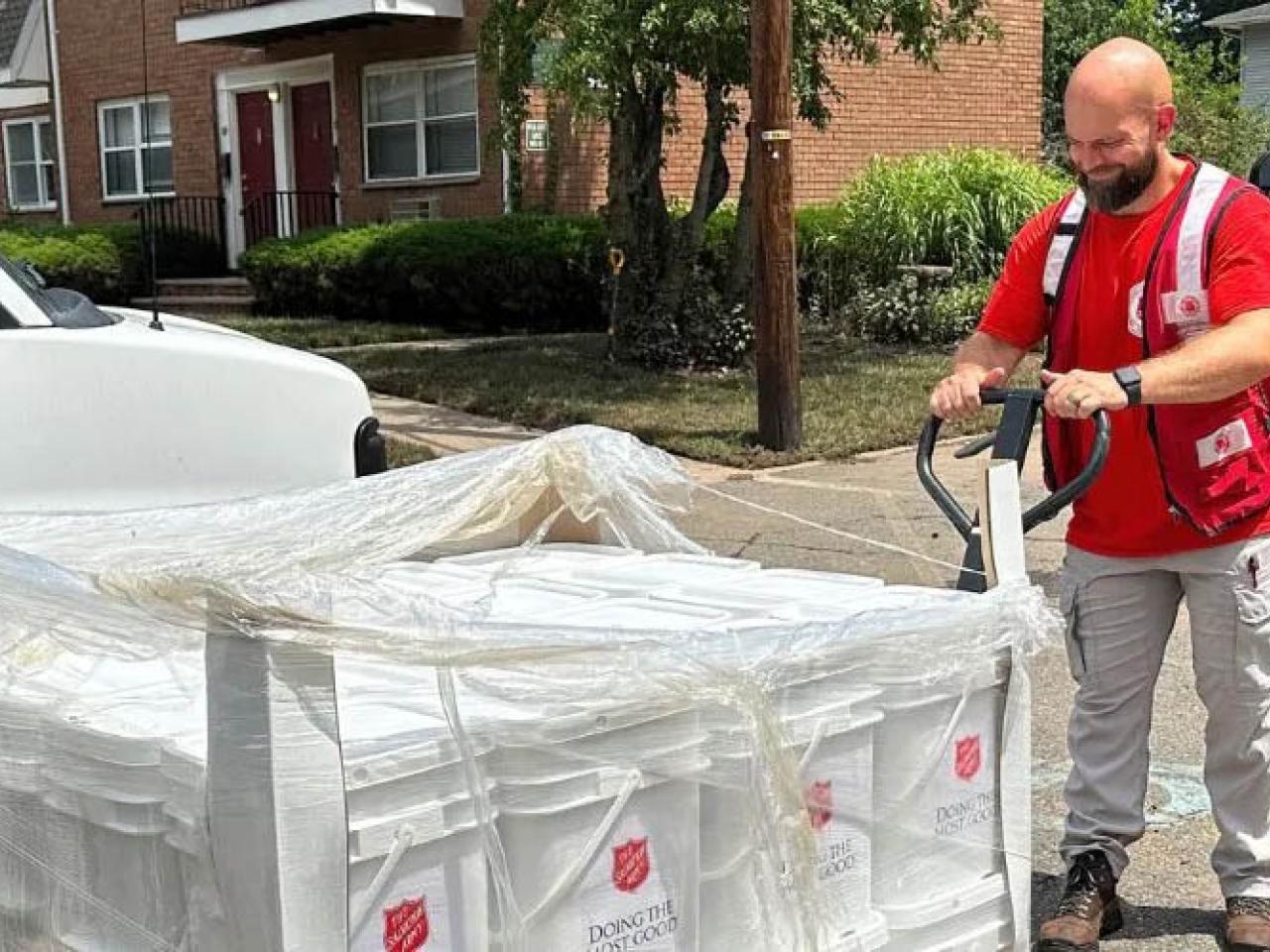 Salvation Army trucks, boxes, and volunteer