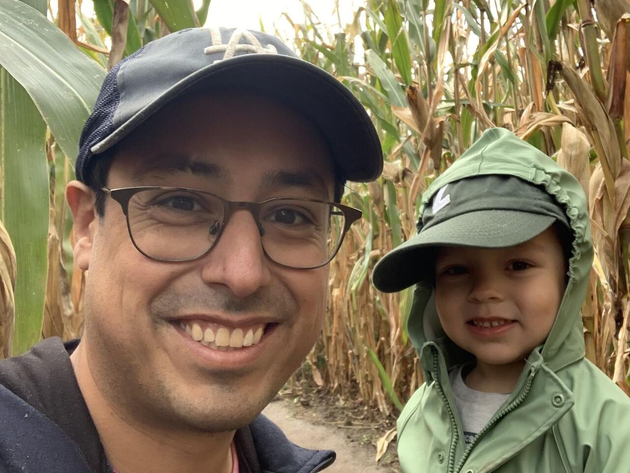 Matthew Sanchez and a child in a corn maze