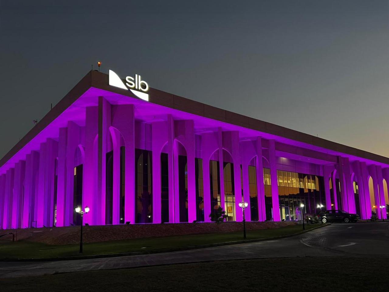 slb building lit up in purple