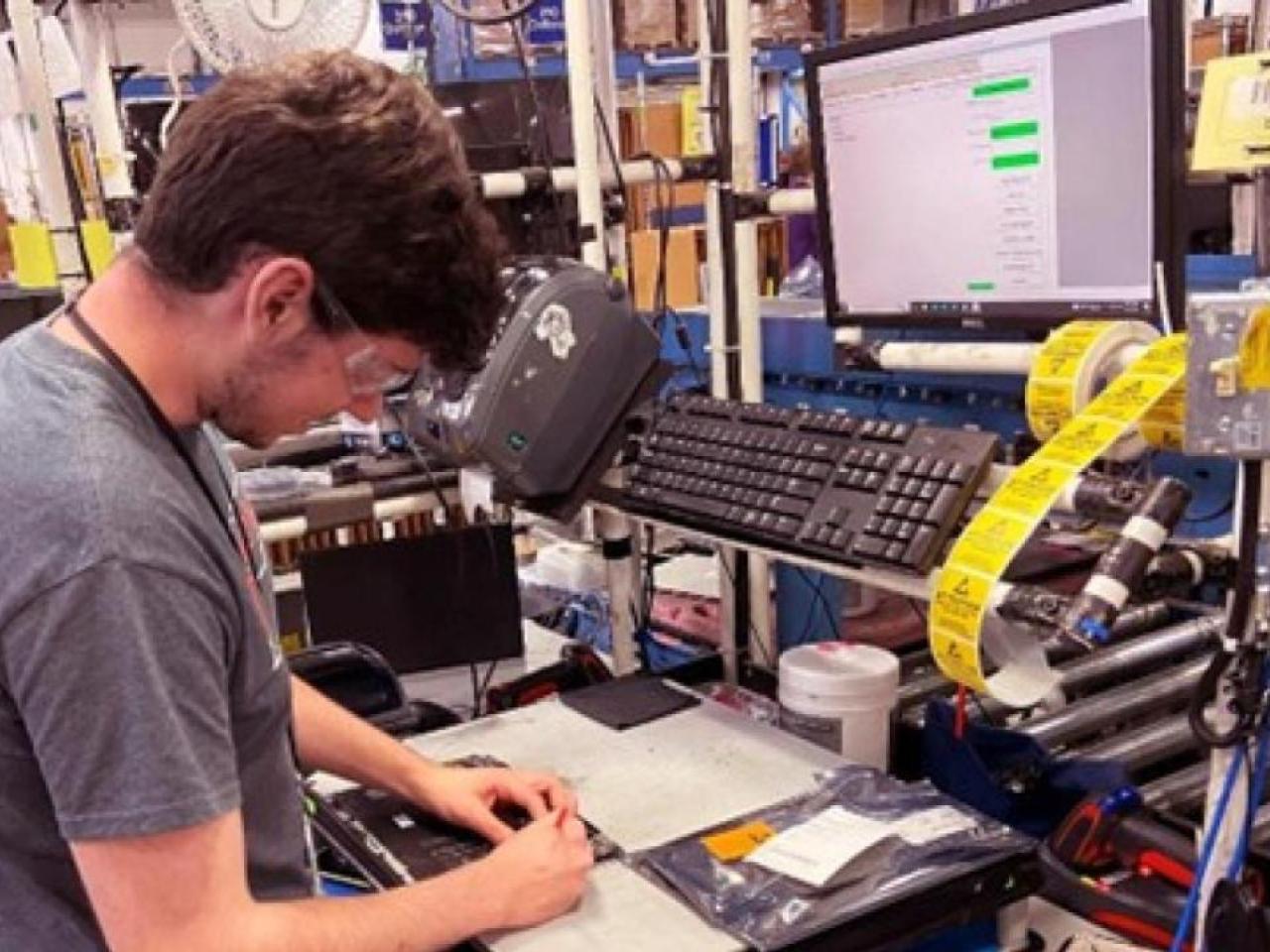 Person working on computer part