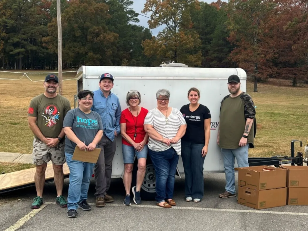People standing together with boxes of donations