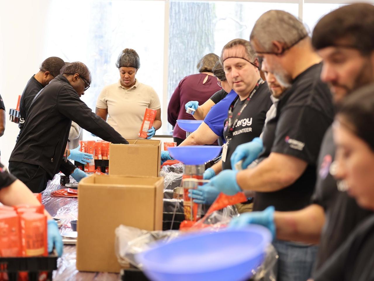 Volunteers packing food