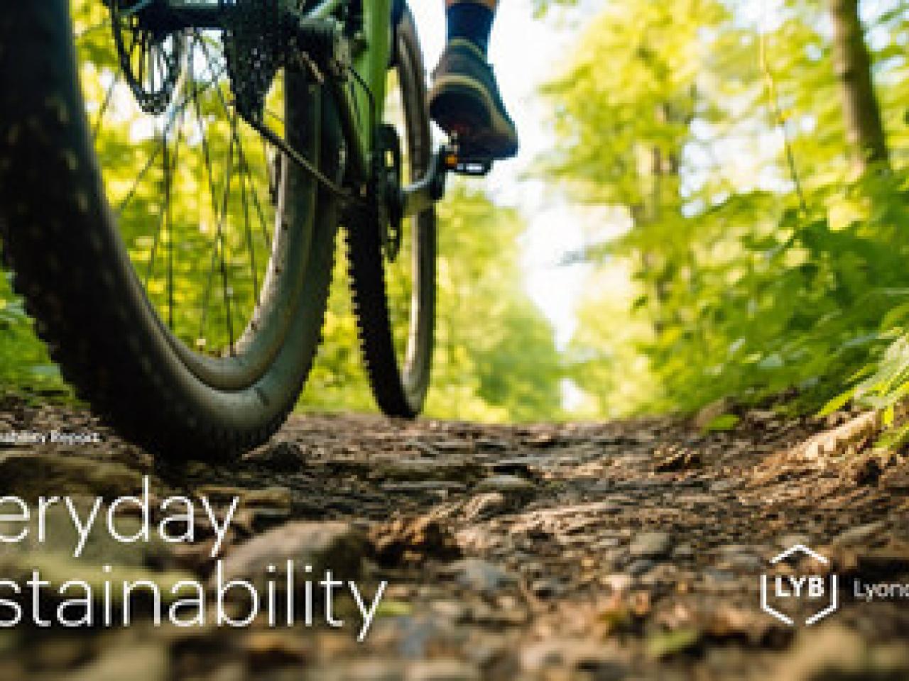 Cover page "Everyday Sustainability" and LyondellBasell logo on a ground-view of a person going by on a bicycle on a dirt path in a tree lined area.