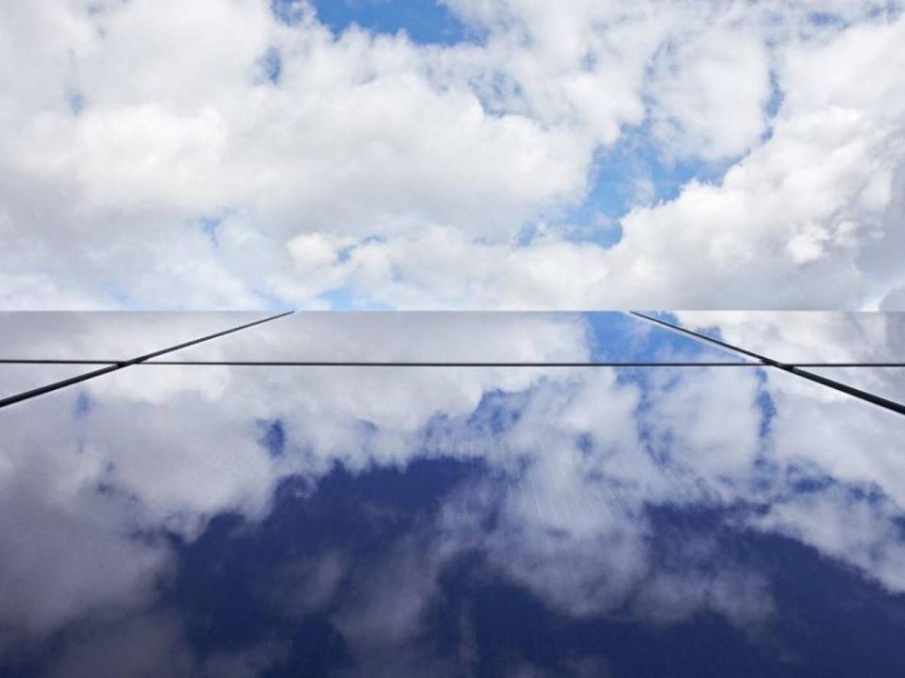 windows mirroring clouds