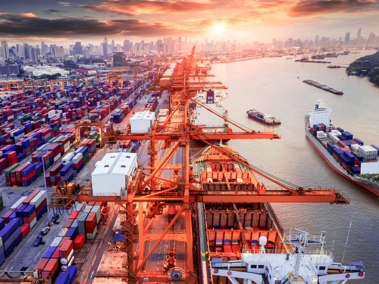 Busy port with shipping containers and vessels