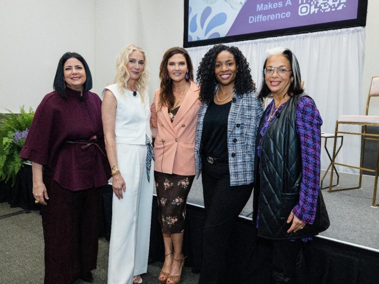 Five women standing together