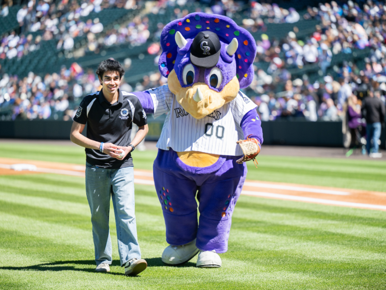 person walking with mascot