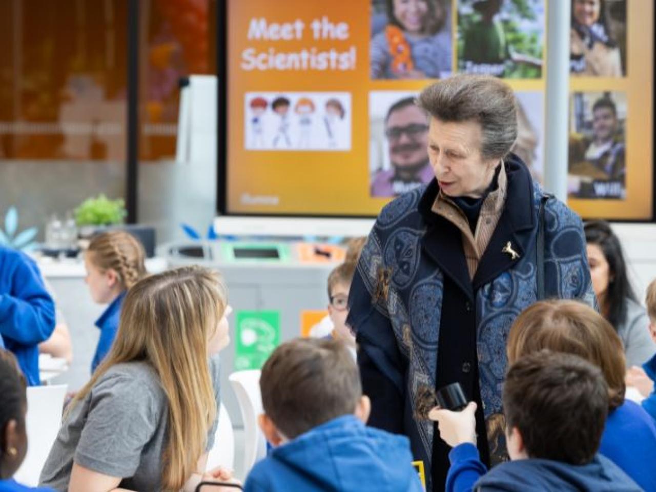 HRH Anne shown with children on DNA Day.