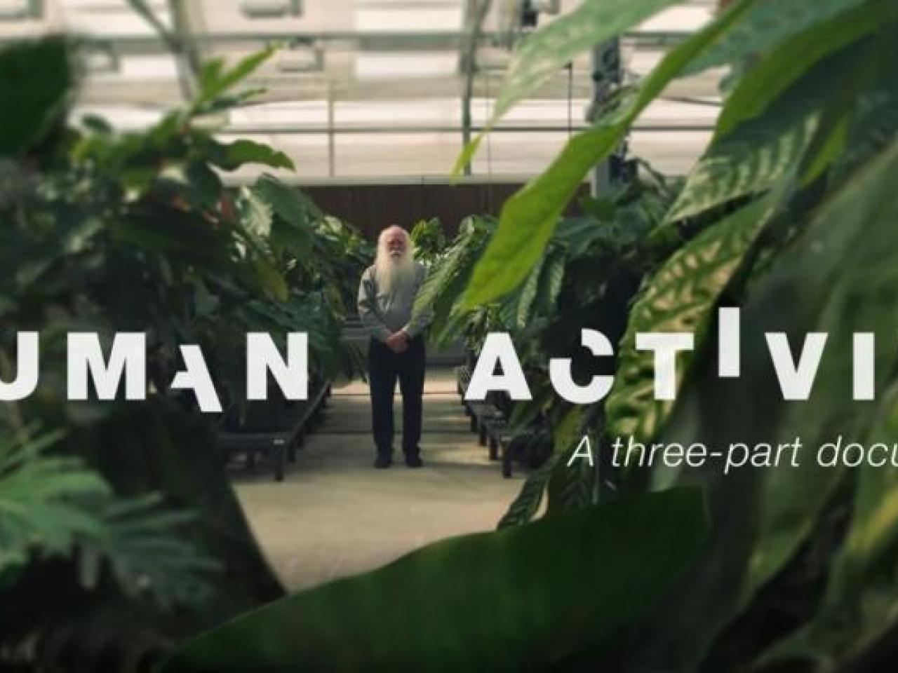 A person standing in the distance in a lush greenhouse. "Human Activity A three part docuseries" in broken letters on top.