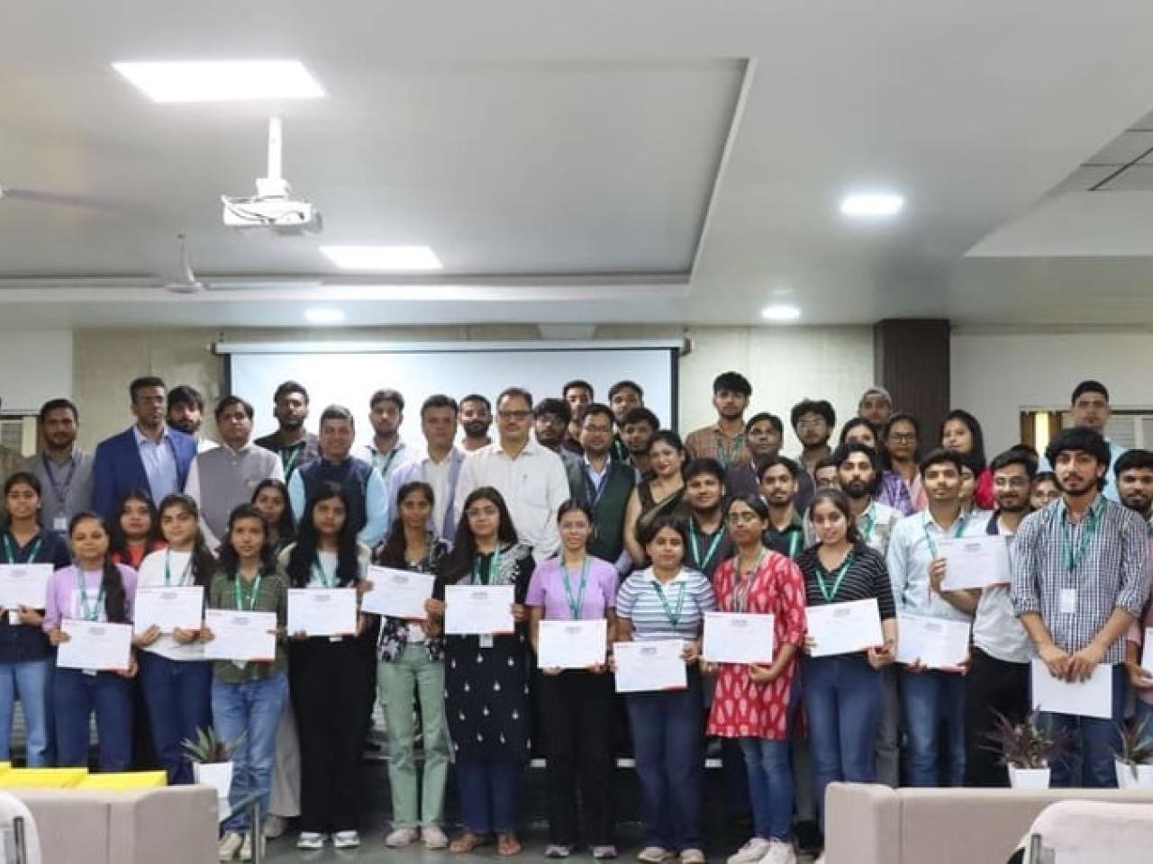 students holding up their certificates