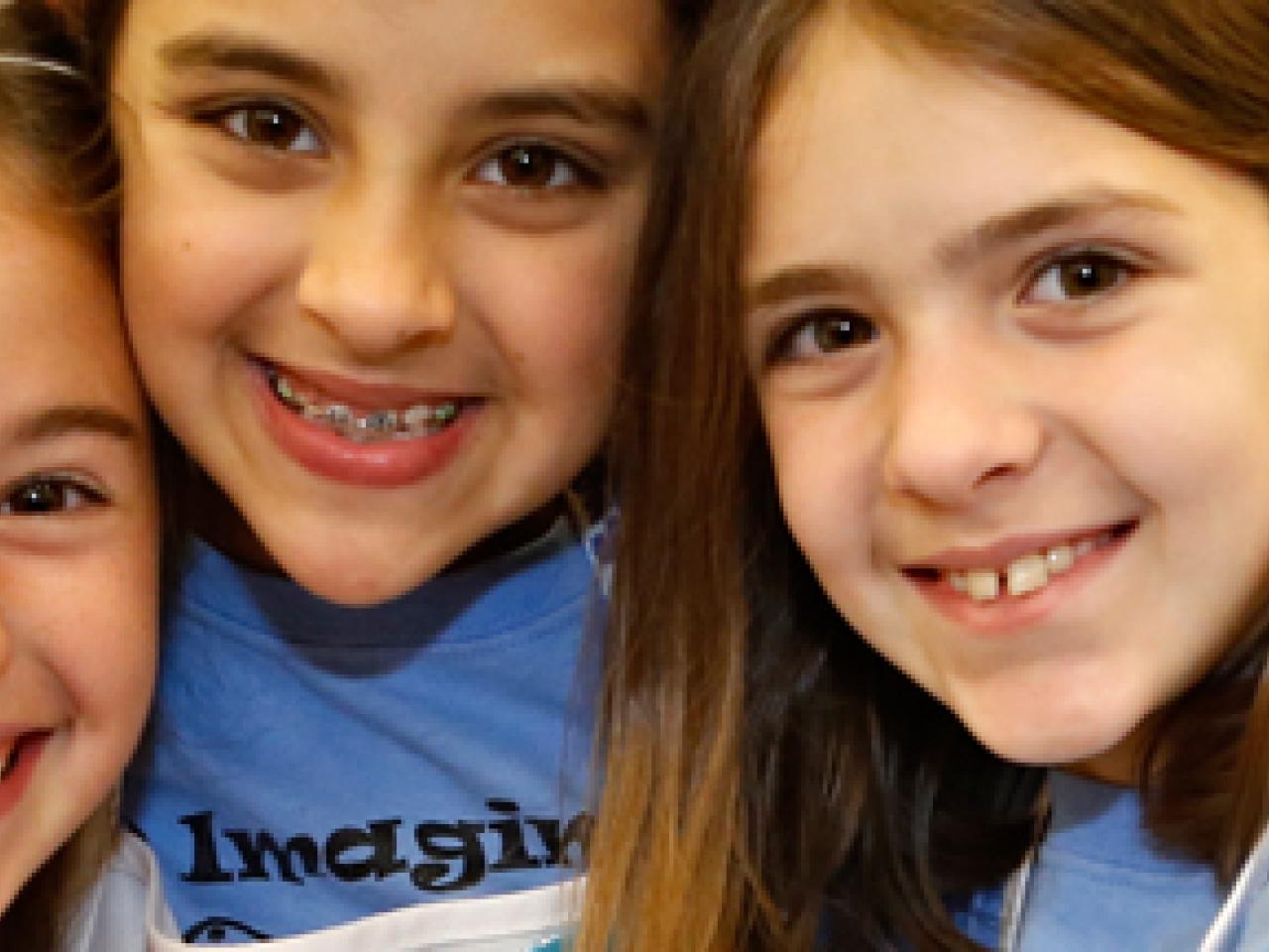 three girls smiling