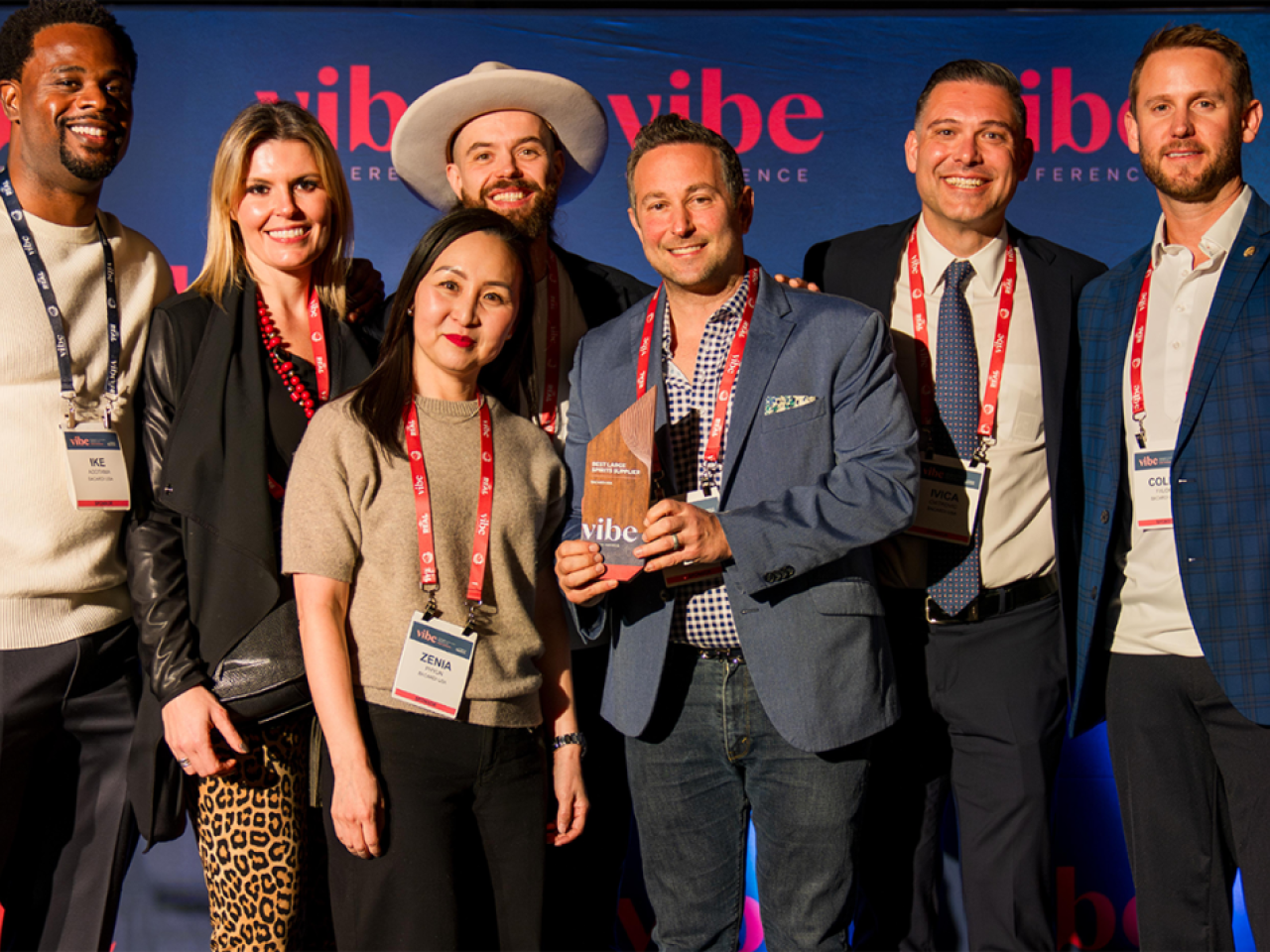 A group holding an award