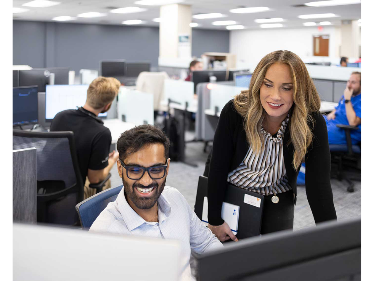 Employees working and smiling