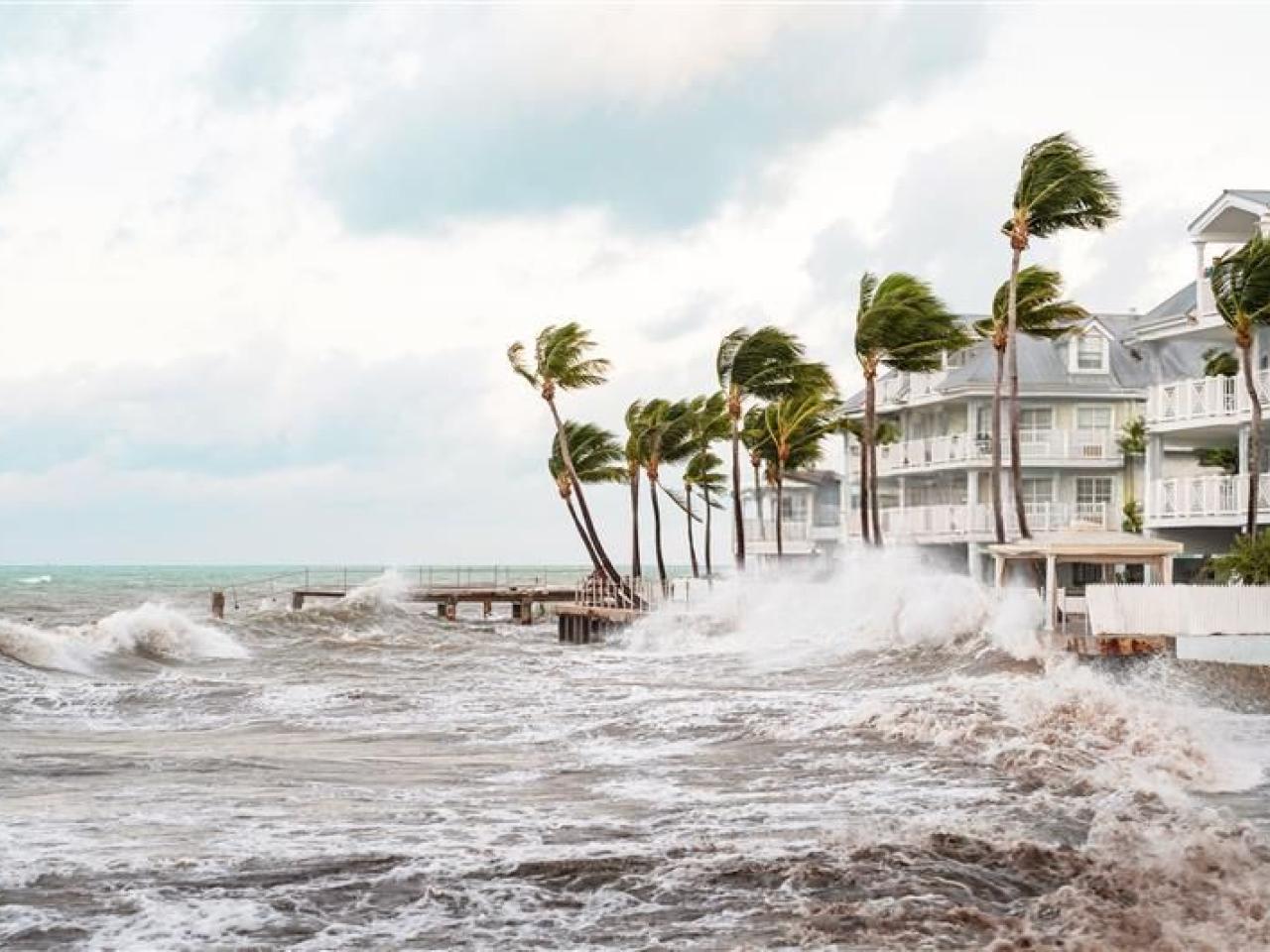 Stormy seas next to apartment buildings