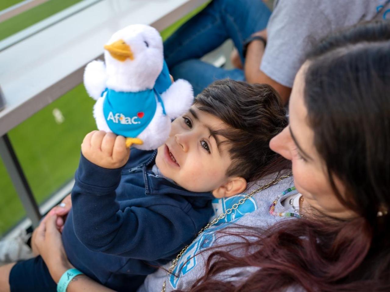A child with an Aflac duck