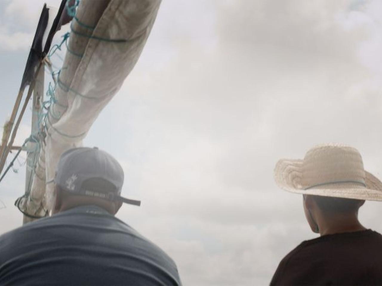 two people on a boat