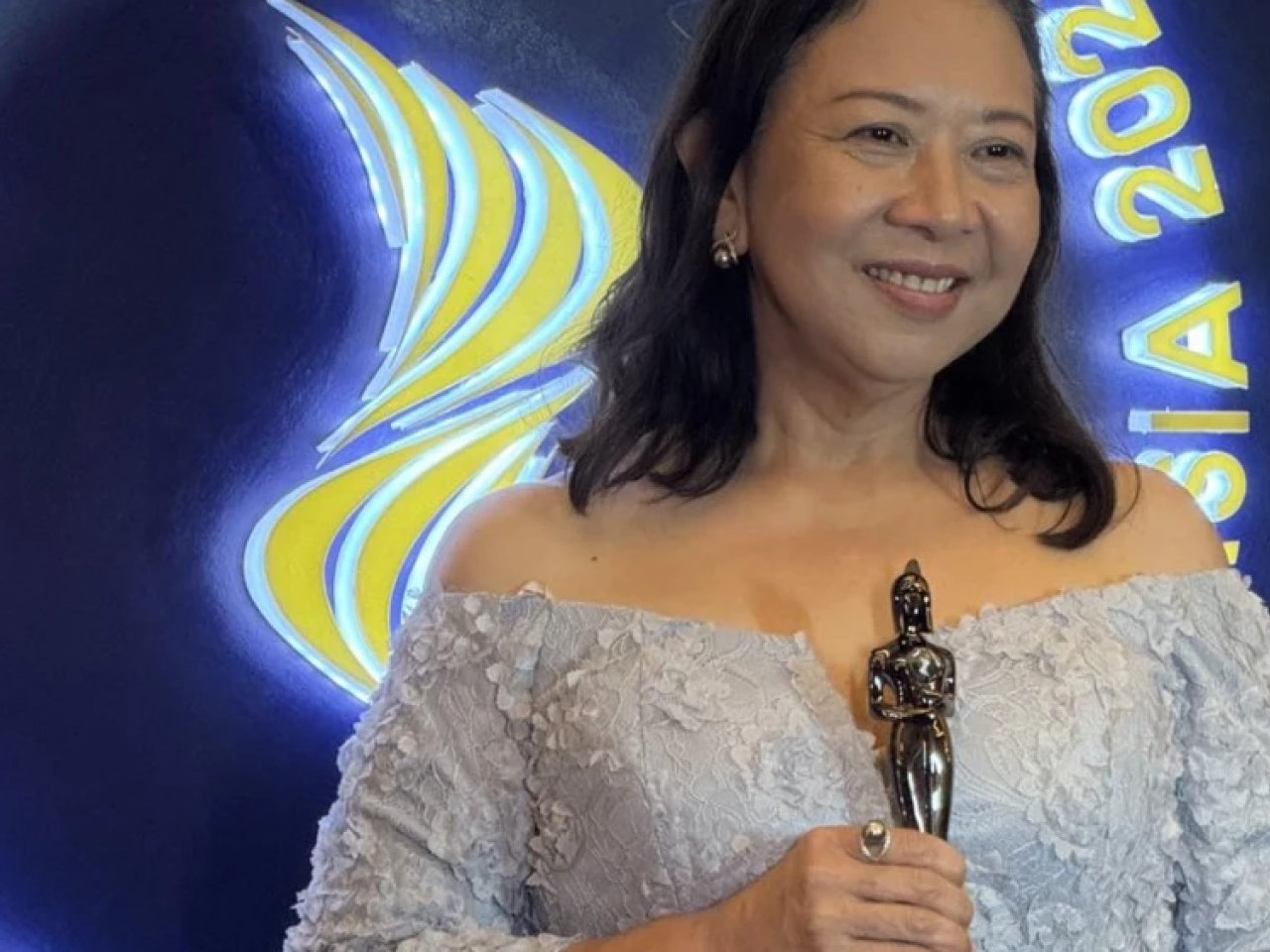 Someone holding an award