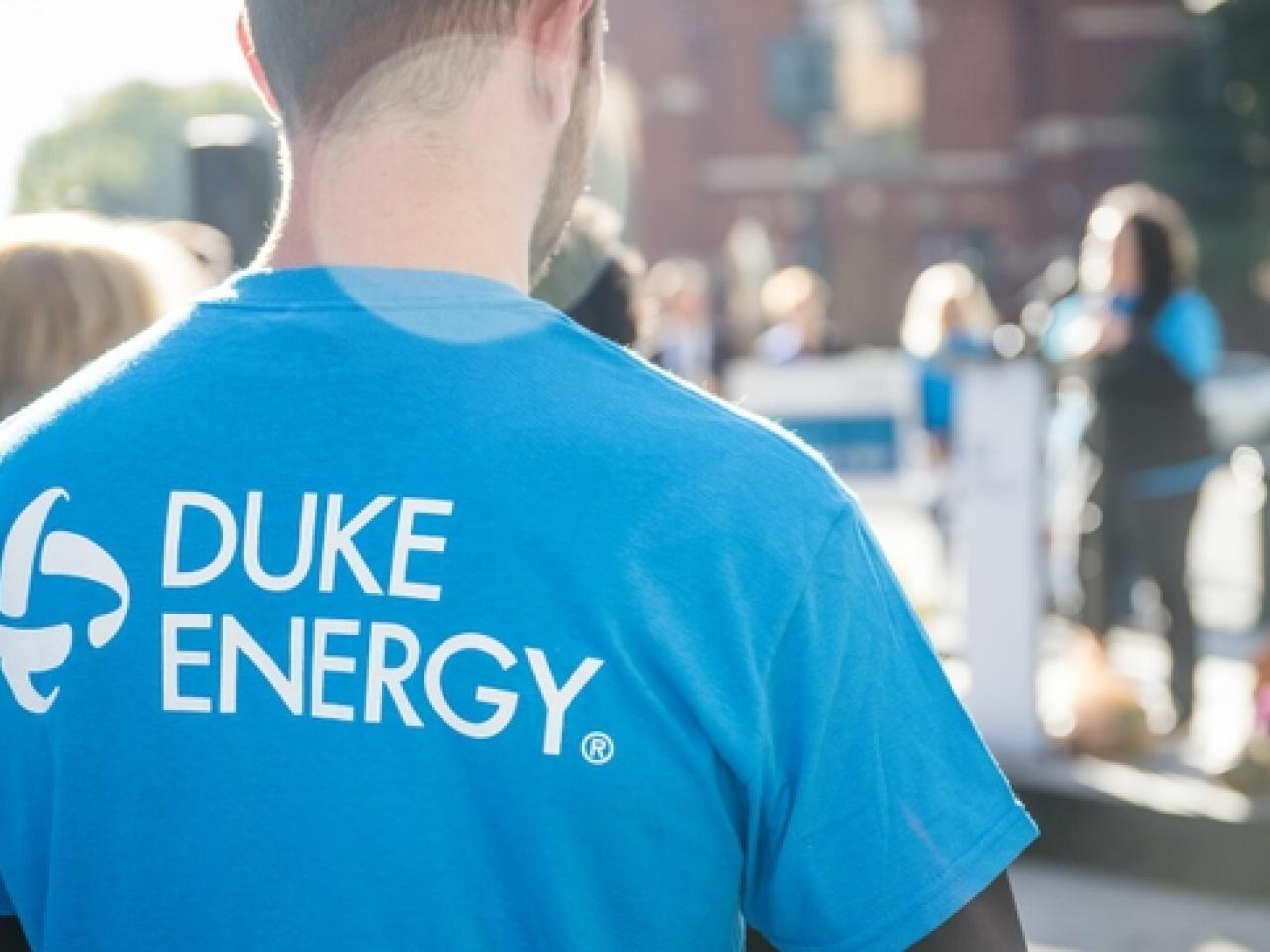 Someone shown from the back wearing a Duke Energy shirt