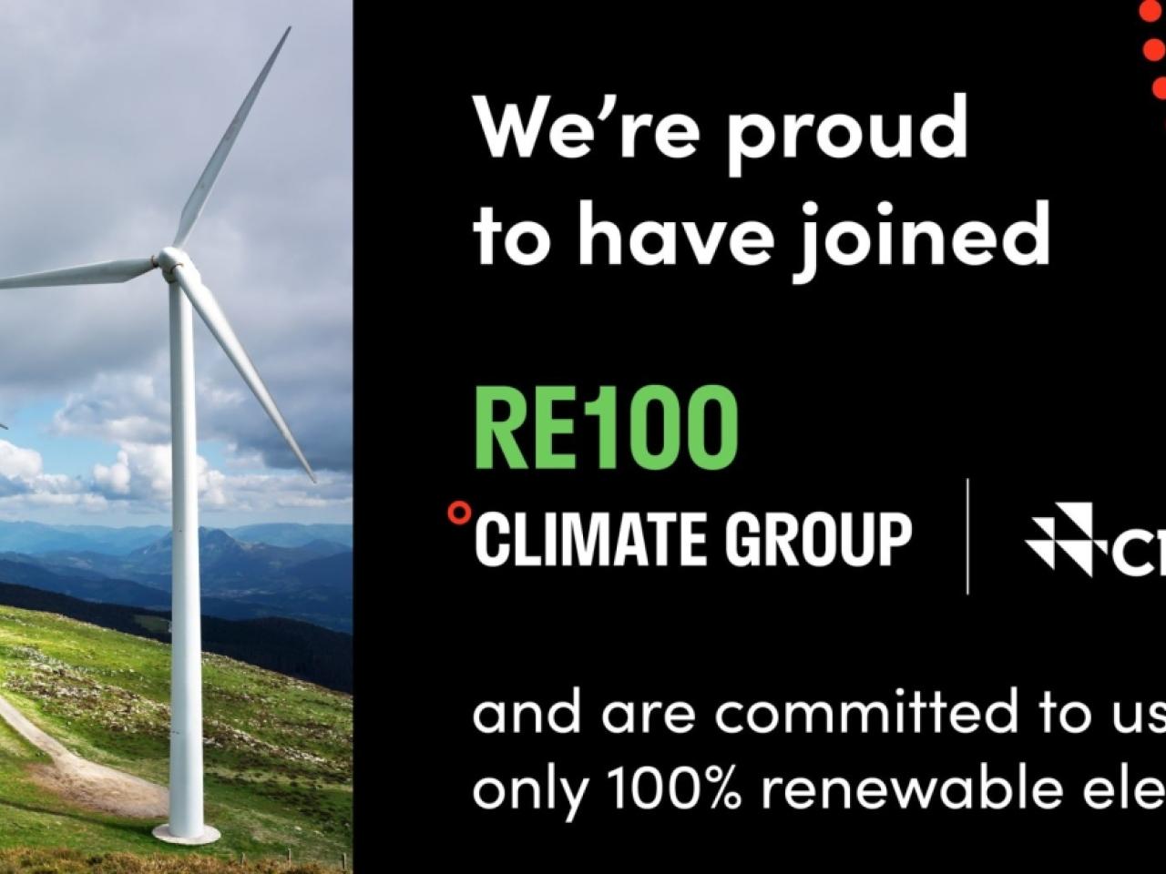 Wind turbines with text: We're proud to have joined RE100 Climate Group and are committed to using only 100% renewable electricity