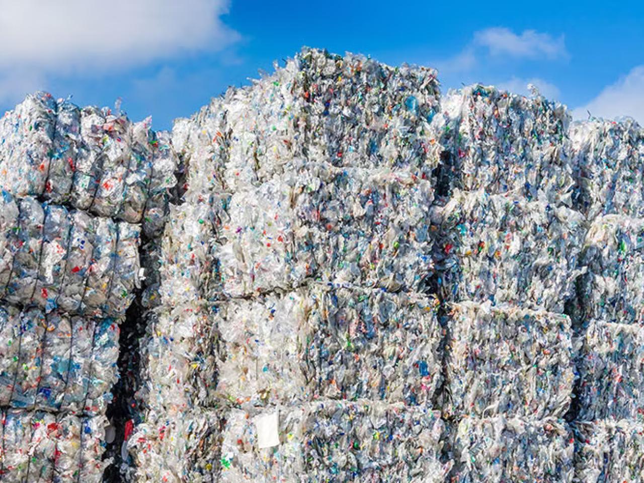 Stacks of bailed plastics for recycling.
