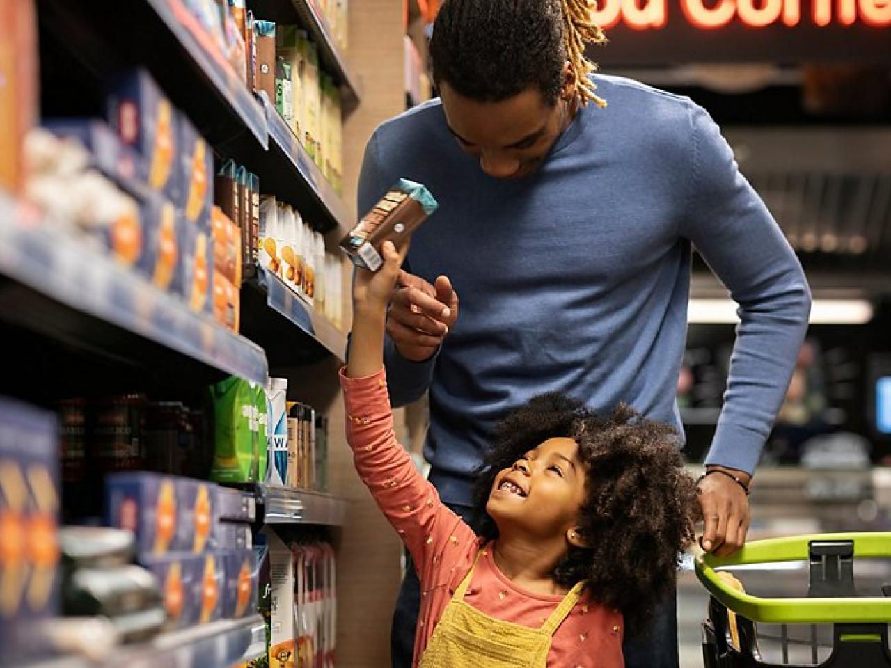 Father and child shopping in grocery store
