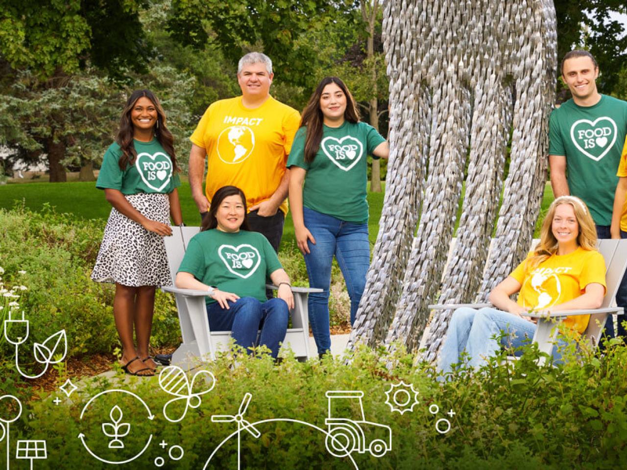 People standing and sitting outdoors in yellow and green tee shirts