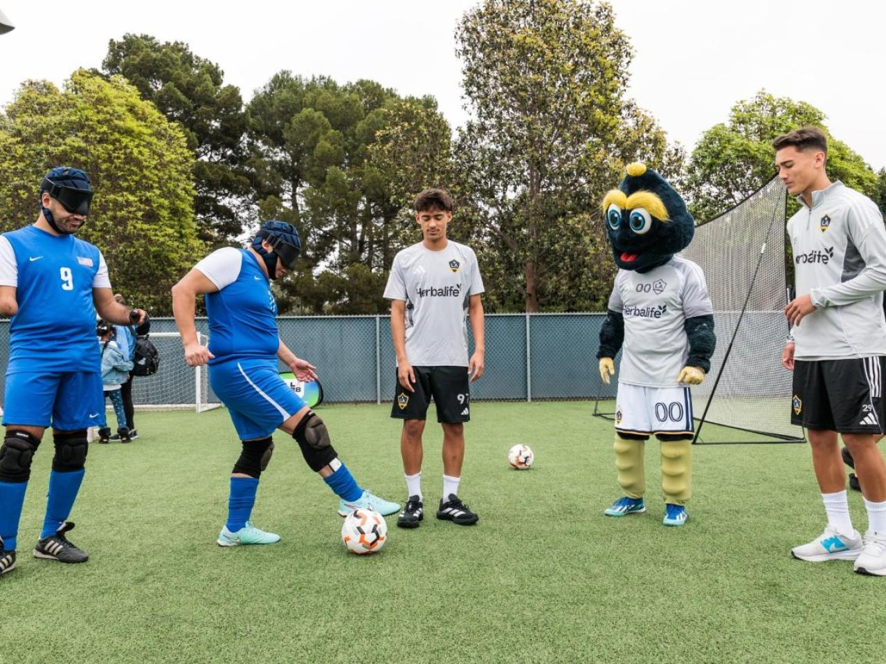 LA Galaxy players and the club’s mascot join adaptive athletes on the field for a skills session during the LA Galaxy Foundation Youth Adaptive Sports Program, reinforcing the power of sport to build confidence and community.