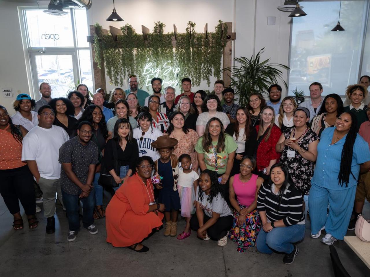 A large group of people smiling for the camera