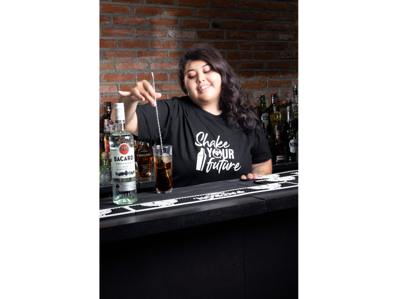 person mixing a drink