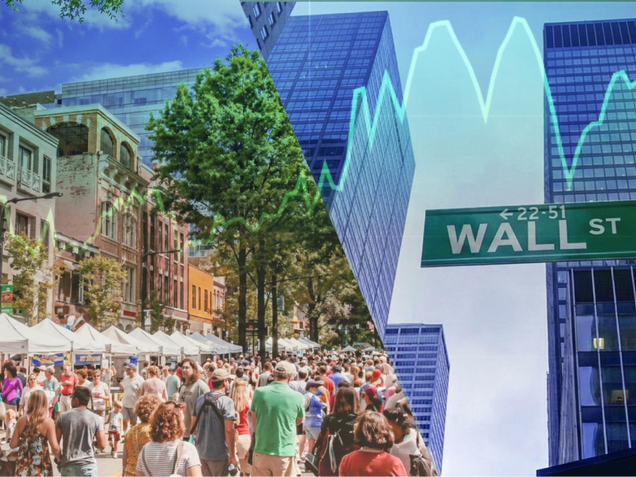 Wall Street sign and people in the street