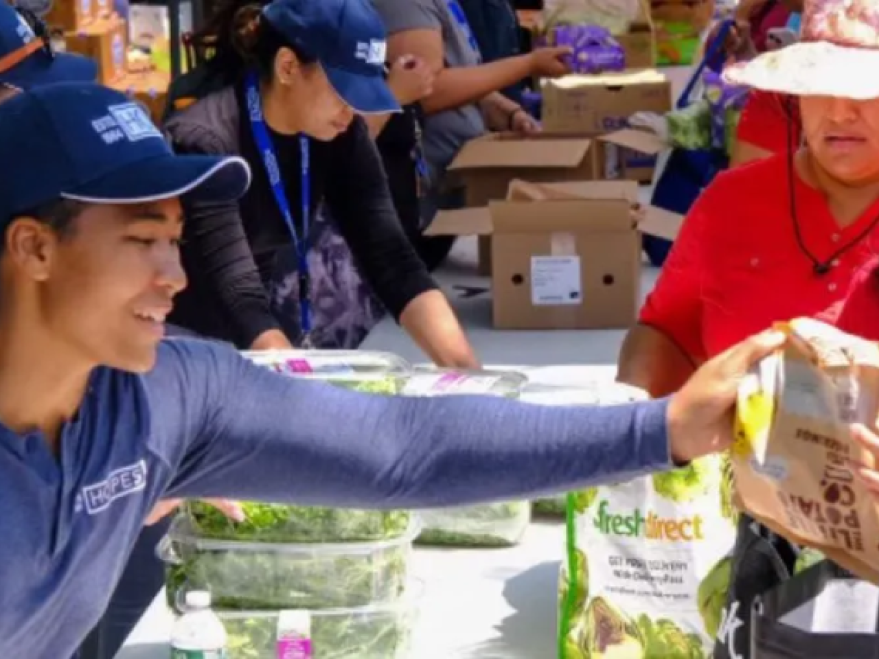 Someone handing food to someone