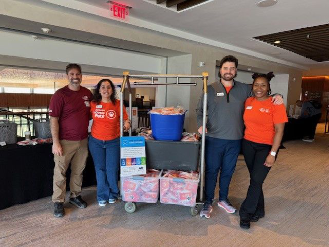 Volunteers with assembled pet adoption kits