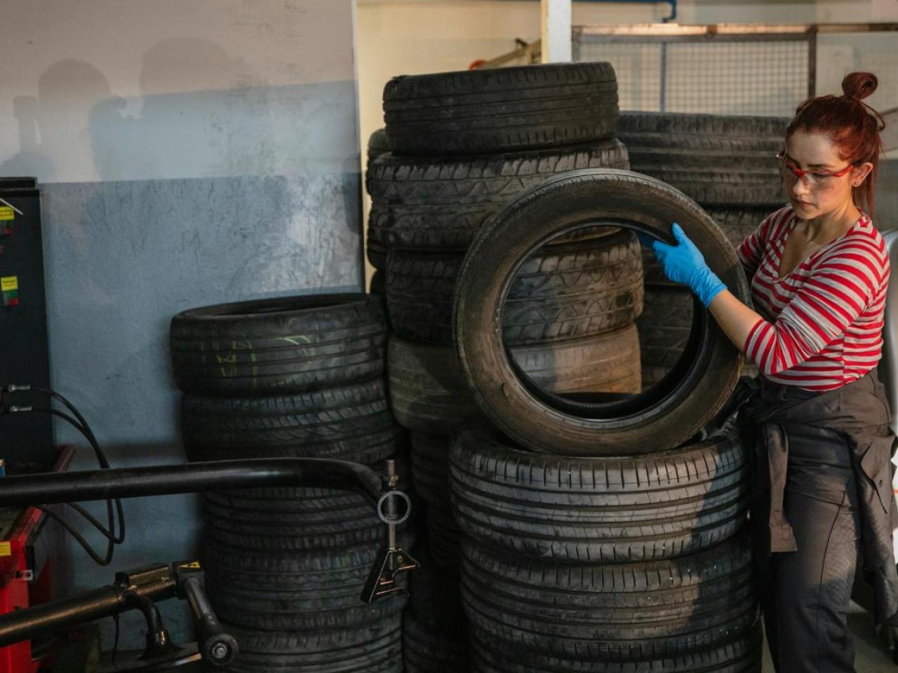 Person stacking tires