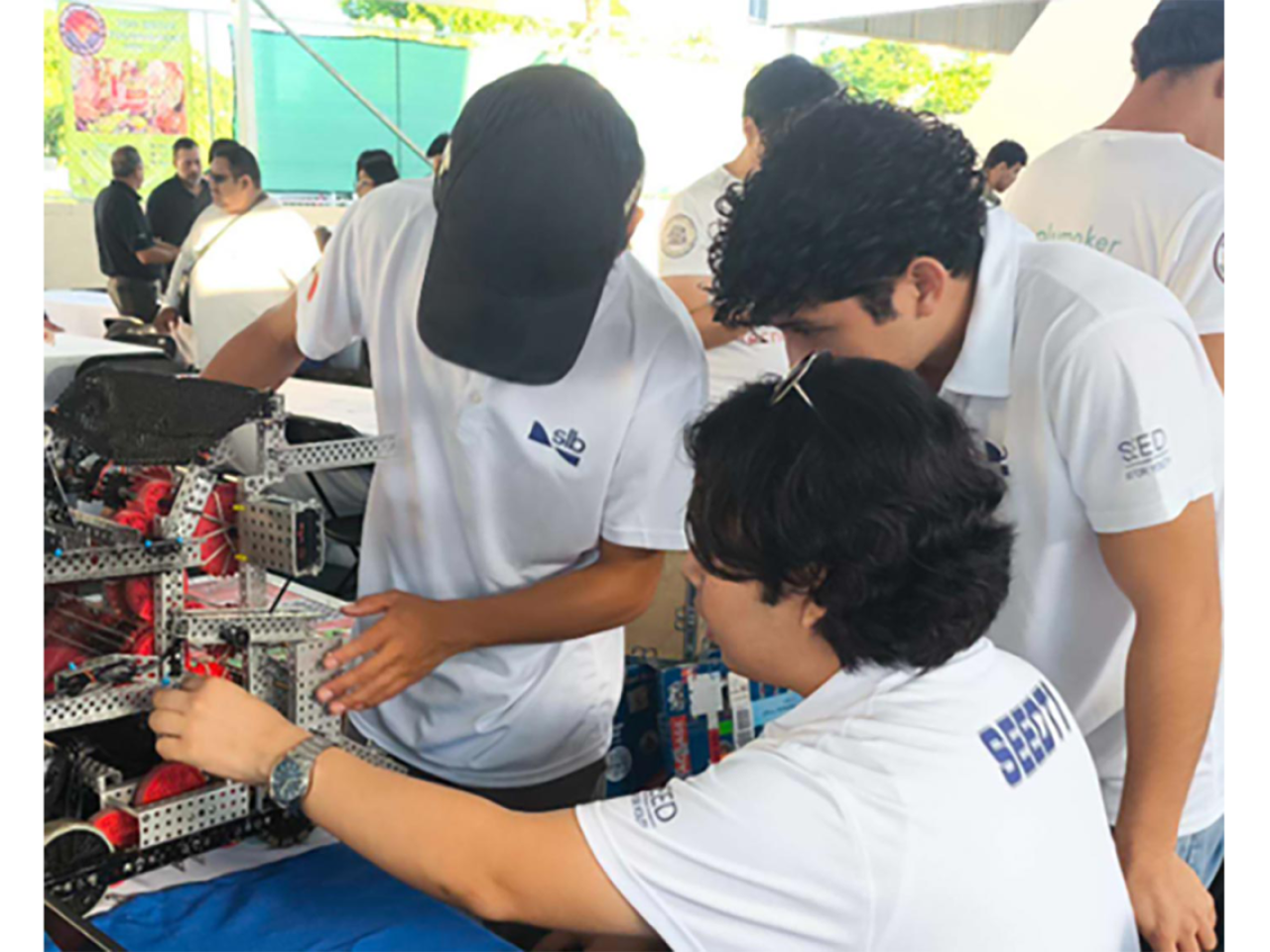 three students working on a project